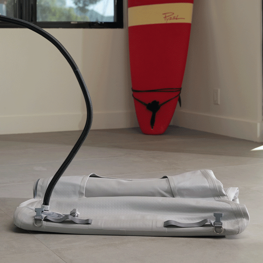 Man inflating Enventur Travel Kennel