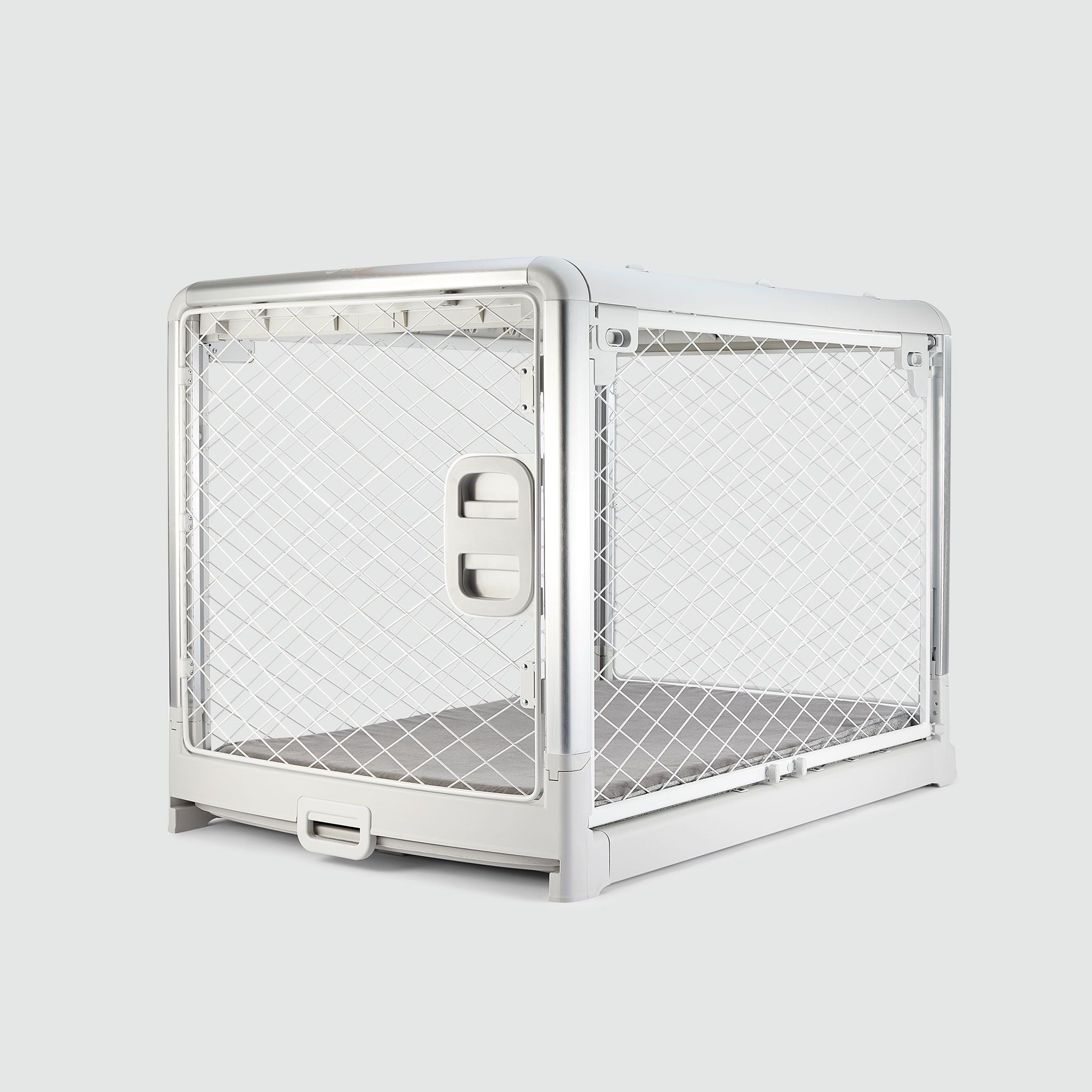 An Ash White Revol Dog Crate pictured diagonally from the front on an offwhite background