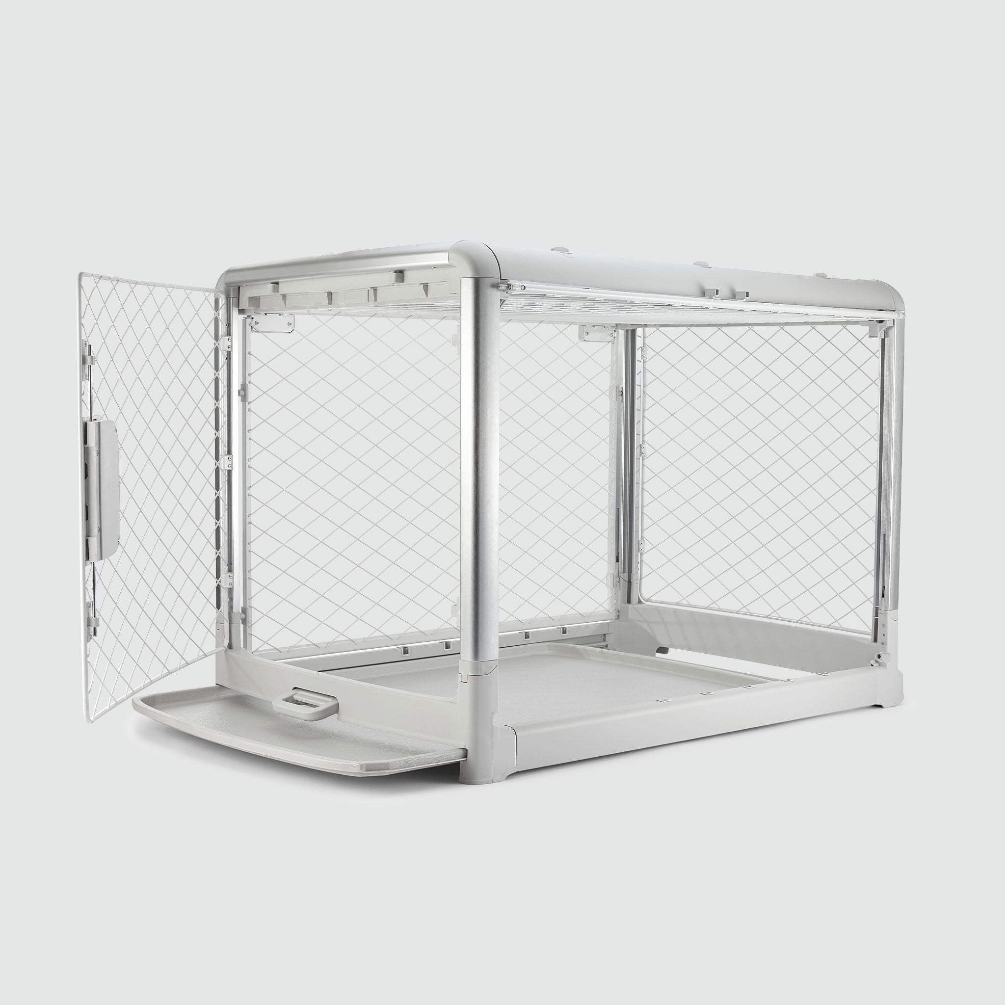 A white dog crate with a door open