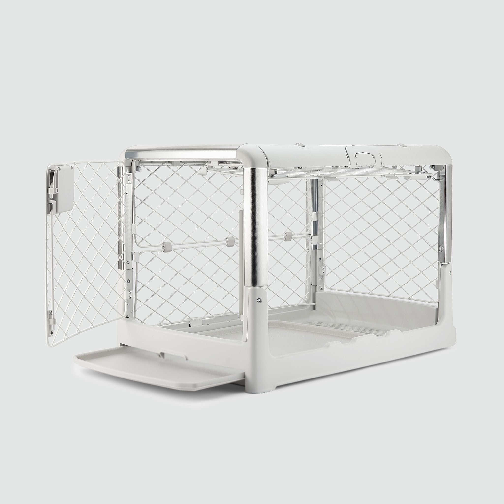 A white dog kennel with the door open