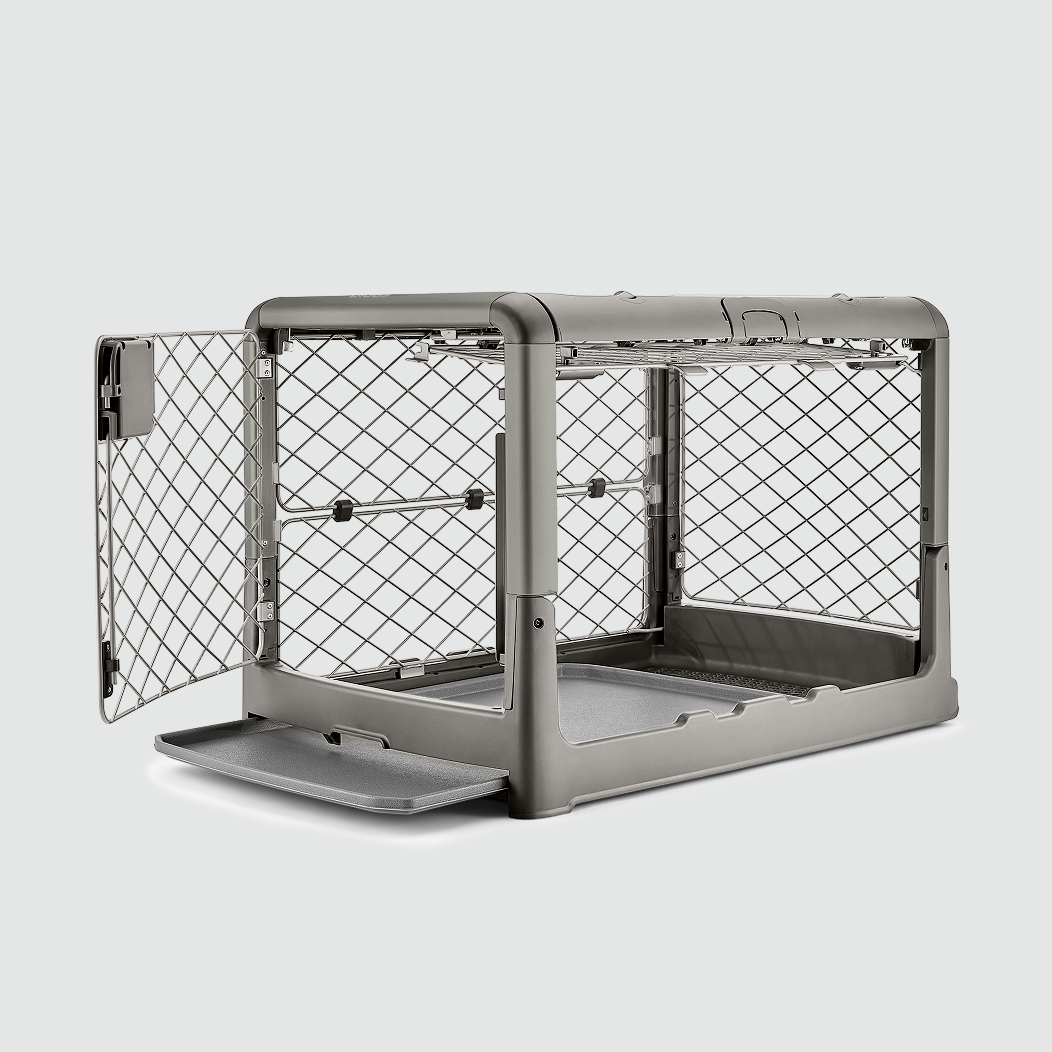 A side view shot of the open doors on the S/M Revol crate in Smoke color, while the tray at the bottom is pulled half out.