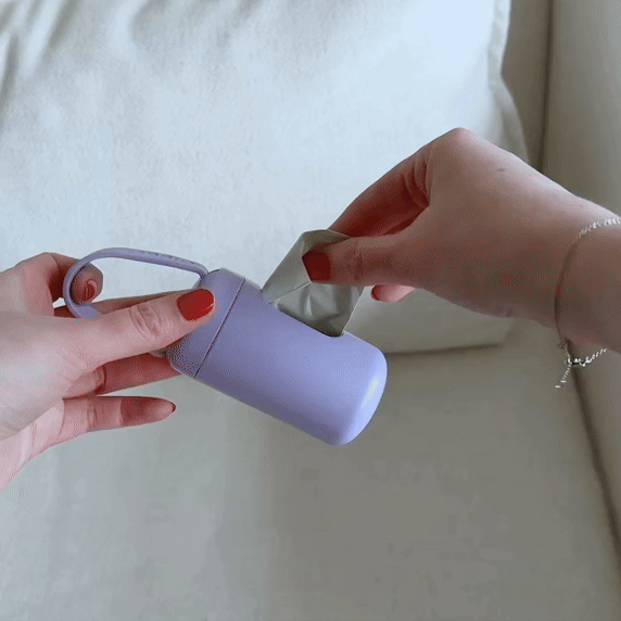 Animated gif of poop bags pulled out of a dispenser one by one