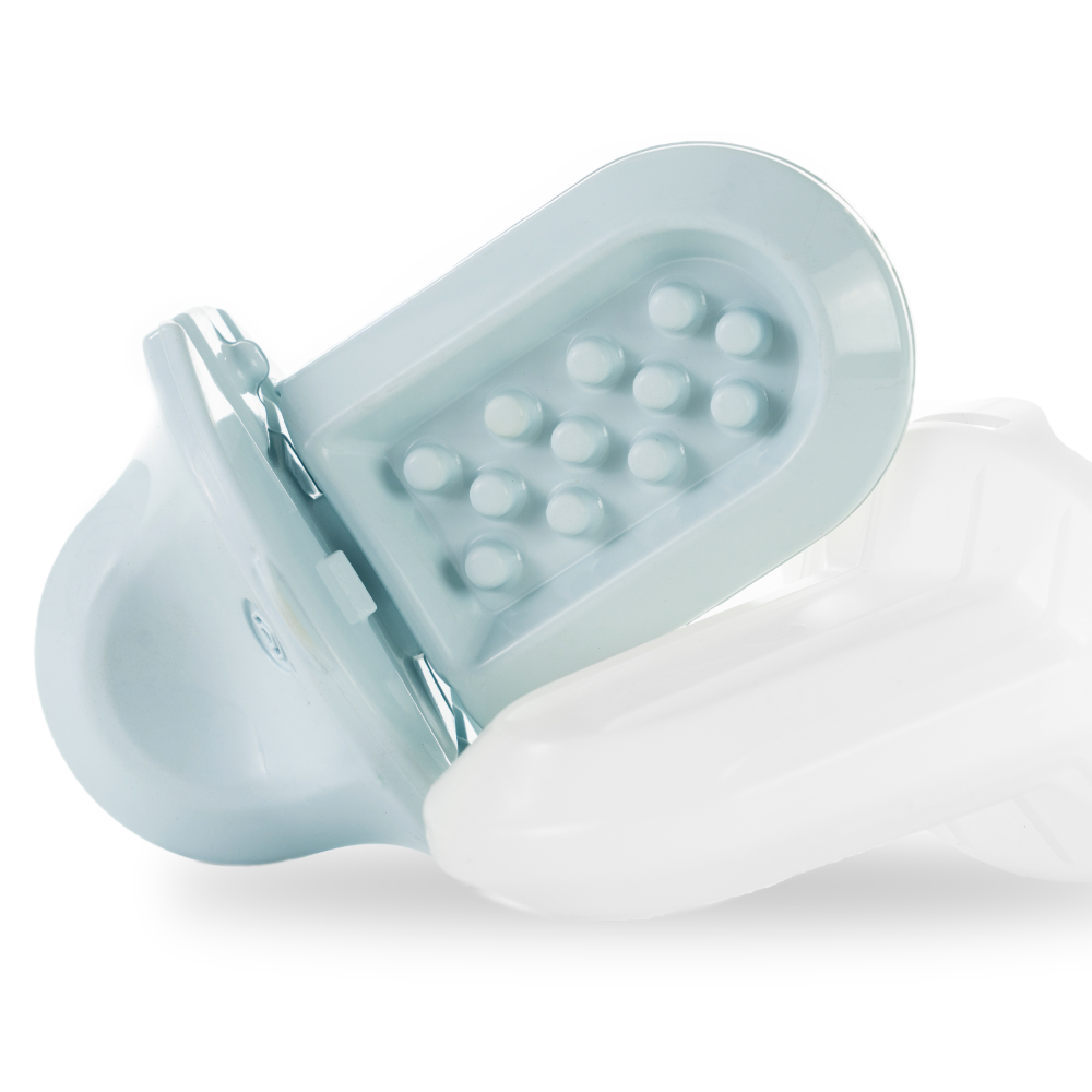 a close up of an Ice Groov next to its freezer shell on a white background
