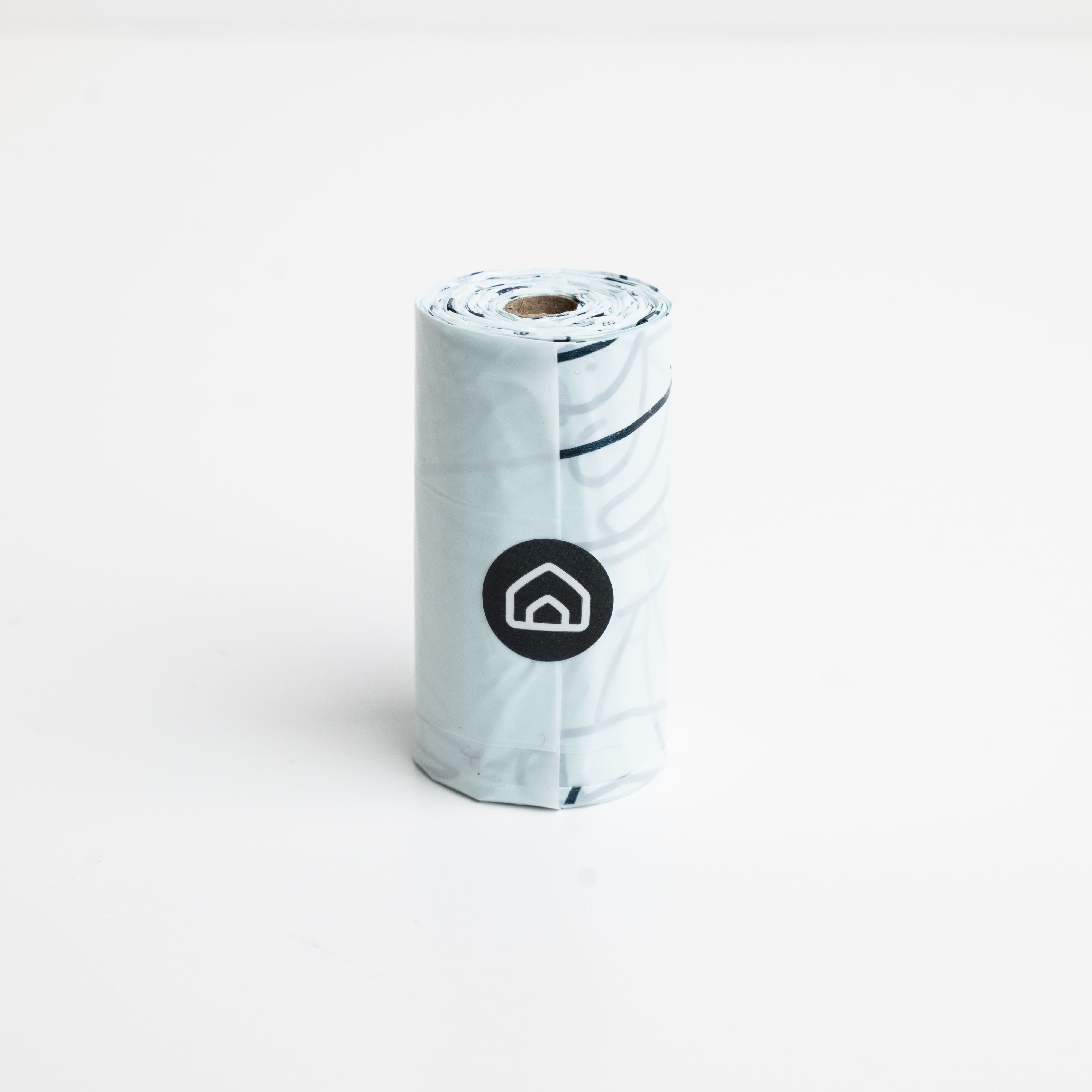 a roll of poop bags on a white background