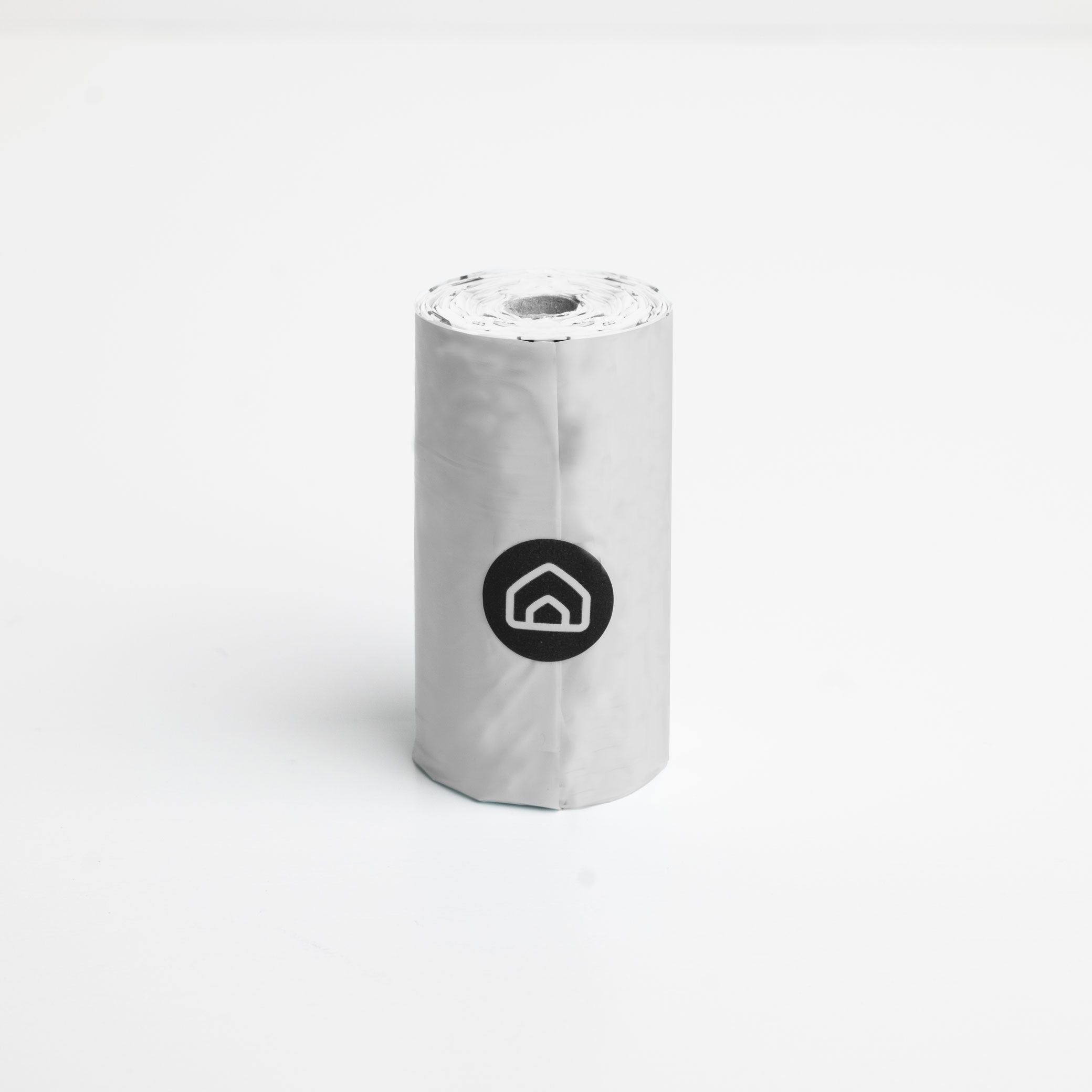 A roll of poop bags pictured on a white background