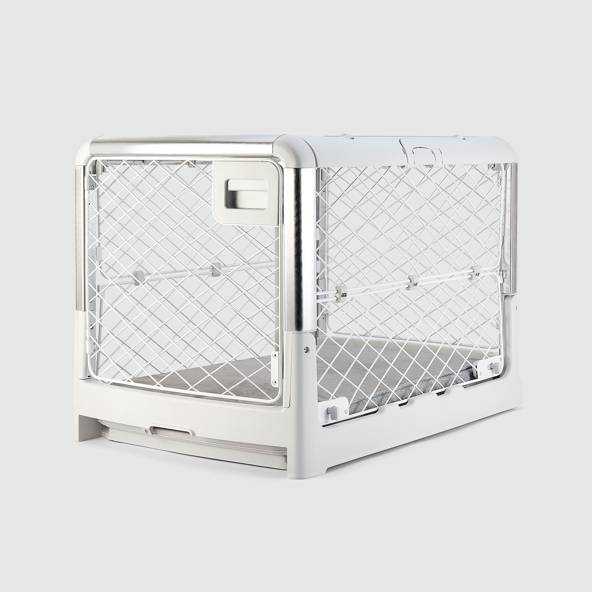 An Ash White Revol Dog Crate pictured diagonally from the front on an offwhite background
