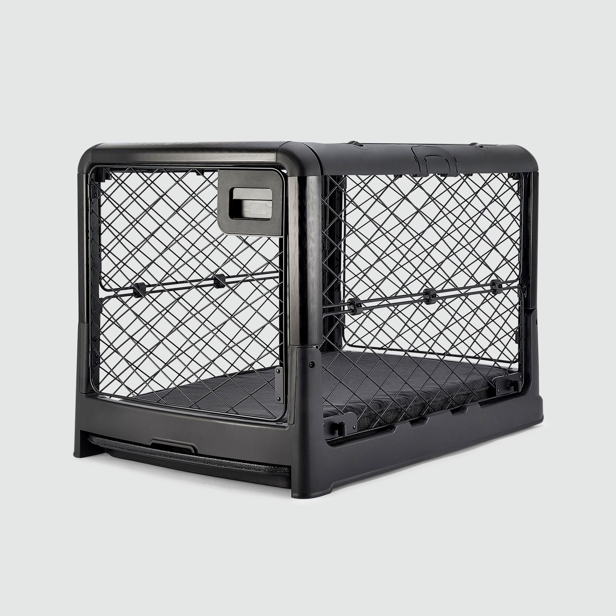 A Charcoal Black Revol Dog Crate pictured diagonally from the front on an offwhite background