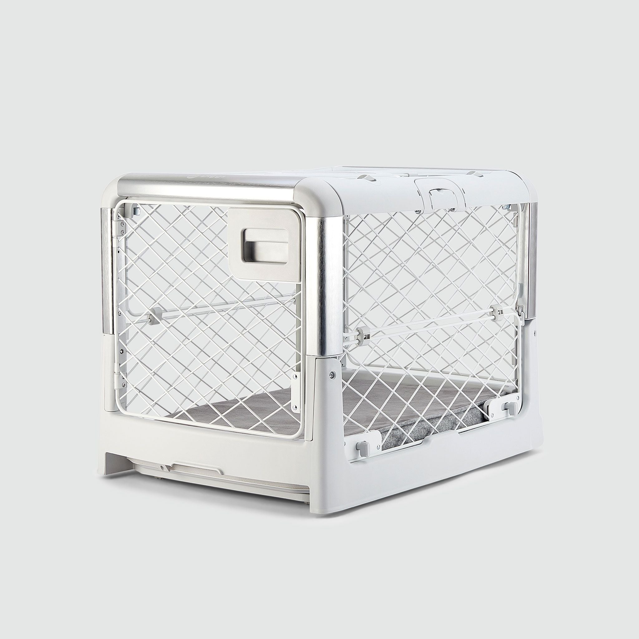 An Ash Revol Dog Crate pictured diagonally from the front on an offwhite background