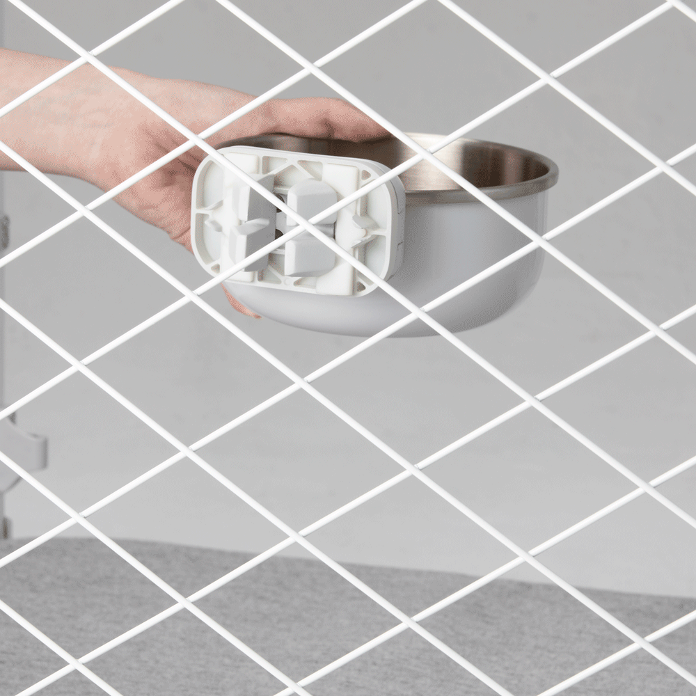 A person is attaching the Diggs Bowl to a crate